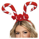 diadema con bastones de caramelo rojos complemento para look navideño festivo y divertido